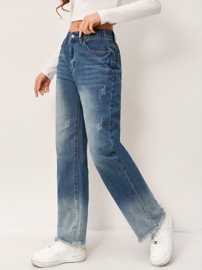 Newness Effortless Chic Straight Leg Jeans: Flattering straight-leg jeans in a versatile wash, designed for both comfort and style. Model showcases the perfect fit and drape.