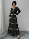 Effortlessly chic Casablanca Tiered Maxi Skirt Set from Newness Model showcasing the complete set featuring a flowing maxi skirt with tiers and a coordinating top