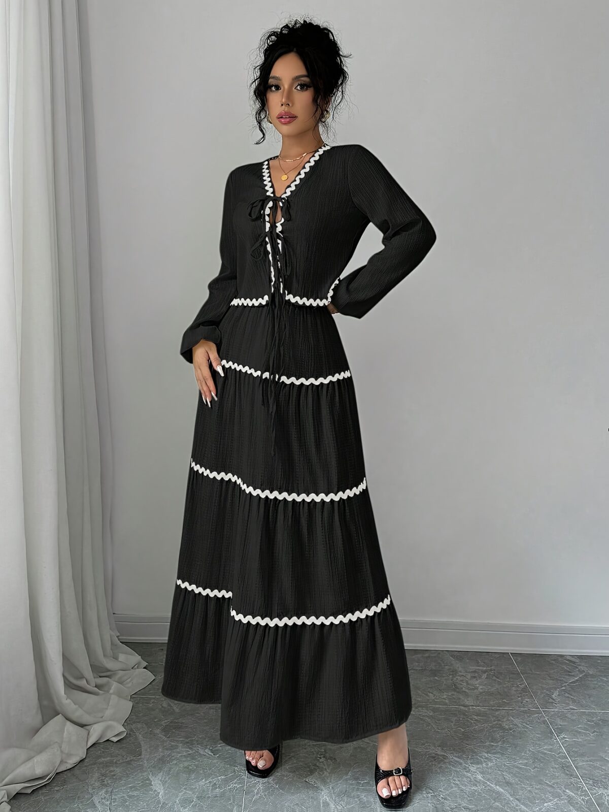Effortlessly chic Casablanca Tiered Maxi Skirt Set from Newness Model showcasing the complete set featuring a flowing maxi skirt with tiers and a coordinating top