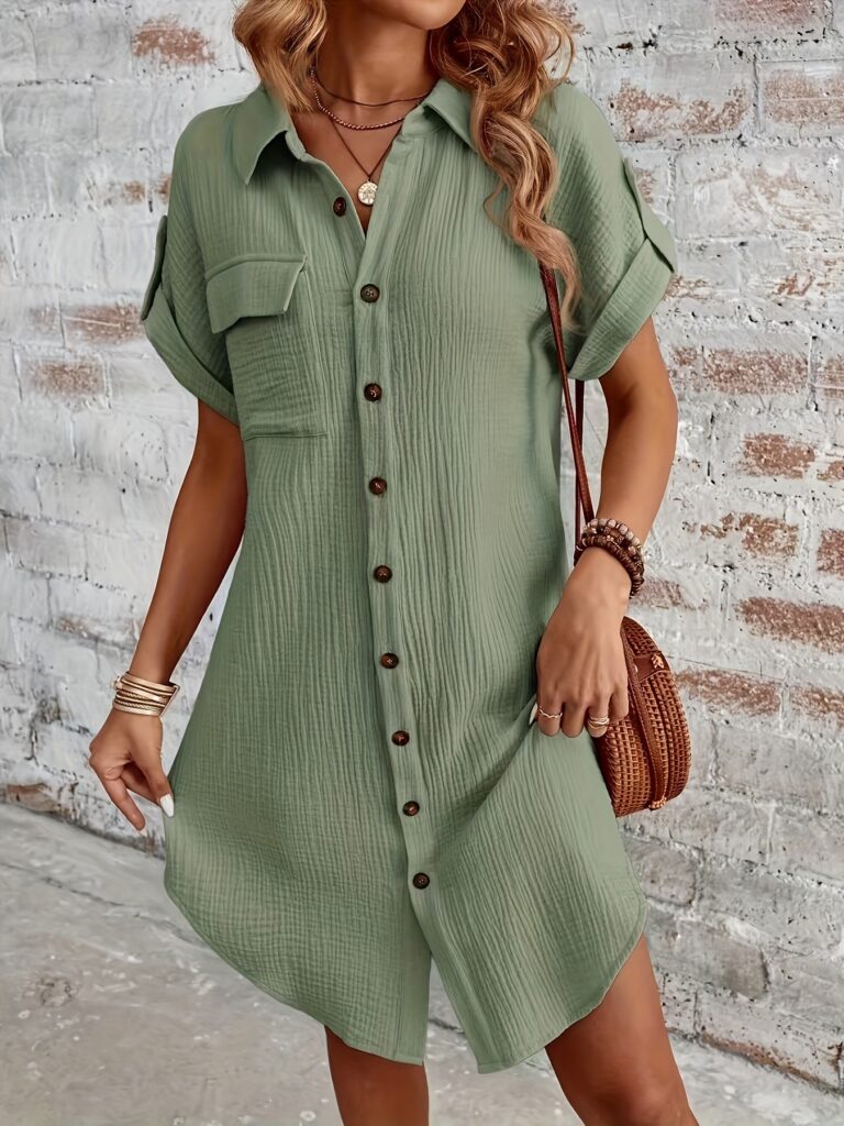 A model wearing a flattering olive green shirtdress, showcasing its versatility and effortless style.