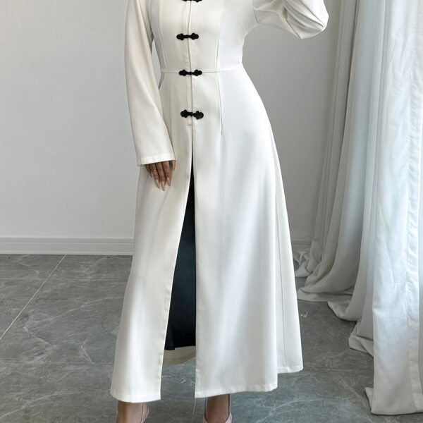 Flattering Timeless Chic Womens Stand Collar Tunic in versatile 100 polyester Featuring a chic stand collar and contrast button details this tunic offers elegance and comfort for all seasons