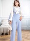 Girl wearing a whimsical floral print outfit ideal for spring and autumn