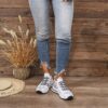 Newness Bloomsbury Floral Print Sneakers Chic and comfortable floral print sneakers perfect for any season View the stylish design