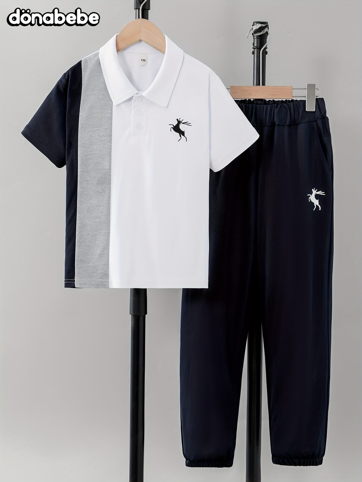 Adorable boys deer print outfit perfect for spring and summer adventures The two piece set includes a comfortable shirt and pants made from a breathable polyester blend Features a trendy deer print
