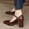 Elegant brown and white vintage style block heel pumps with ankle strap square toe and rubber sole