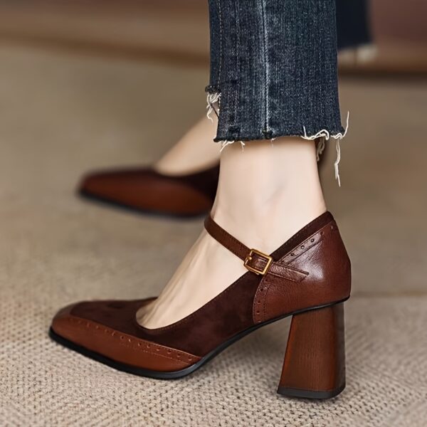 Elegant brown and white vintage style block heel pumps with ankle strap, square toe, and rubber sole.