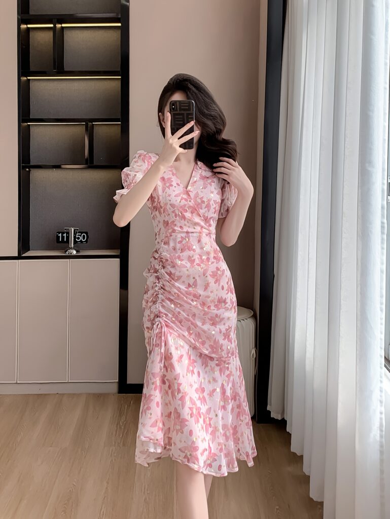 Model wearing a flowing floral chiffon maxi dress, perfect for spring, summer, and fall.