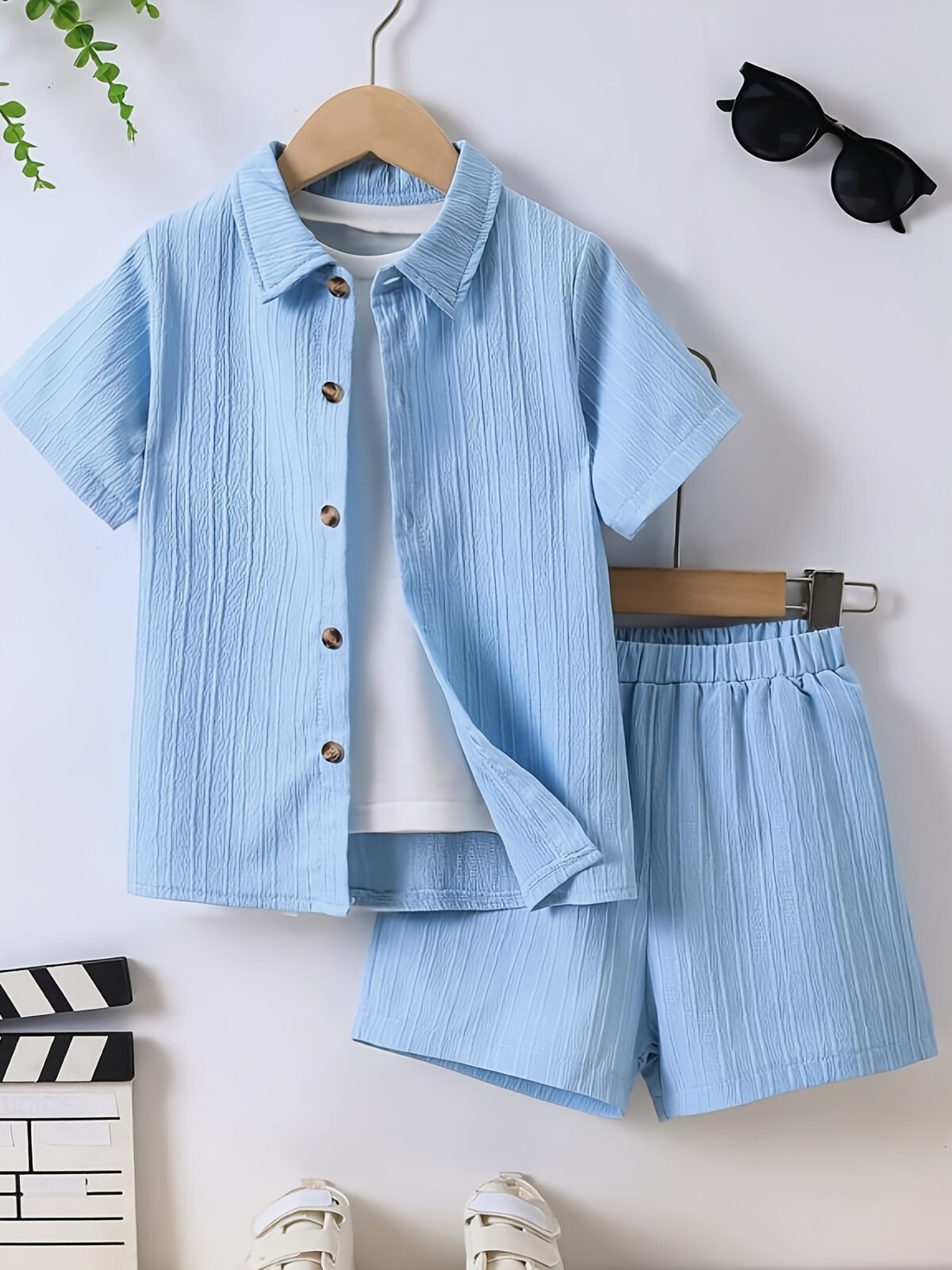 Adorable boy playing outdoors wearing the Newness Summer Breeze Boys Casual Short Set The set is comfortable and perfect for playtime