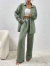 Model wearing the Newness Dubai Nights Off Shoulder Pants Set a luxurious polyester two piece outfit featuring an off shoulder top and wide leg pants perfect for evening events