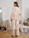 Model wearing a stunning two piece wide leg pants set with a vibrant Dubai Nights print The set is made of luxurious viscose