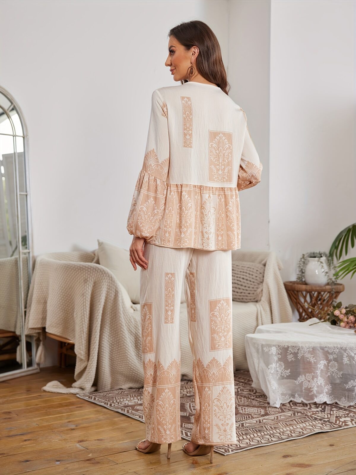Model wearing a stunning two piece wide leg pants set with a vibrant Dubai Nights print The set is made of luxurious viscose