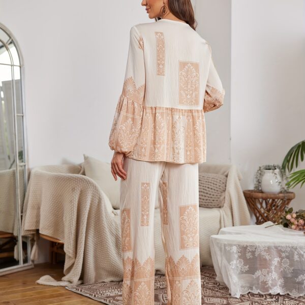 Model wearing a stunning two piece wide leg pants set with a vibrant Dubai Nights print The set is made of luxurious viscose