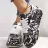 Newness Monochrome Graphic Print Sneakers Stylish and comfortable sneakers with a modern monochrome graphic design perfect for everyday wear