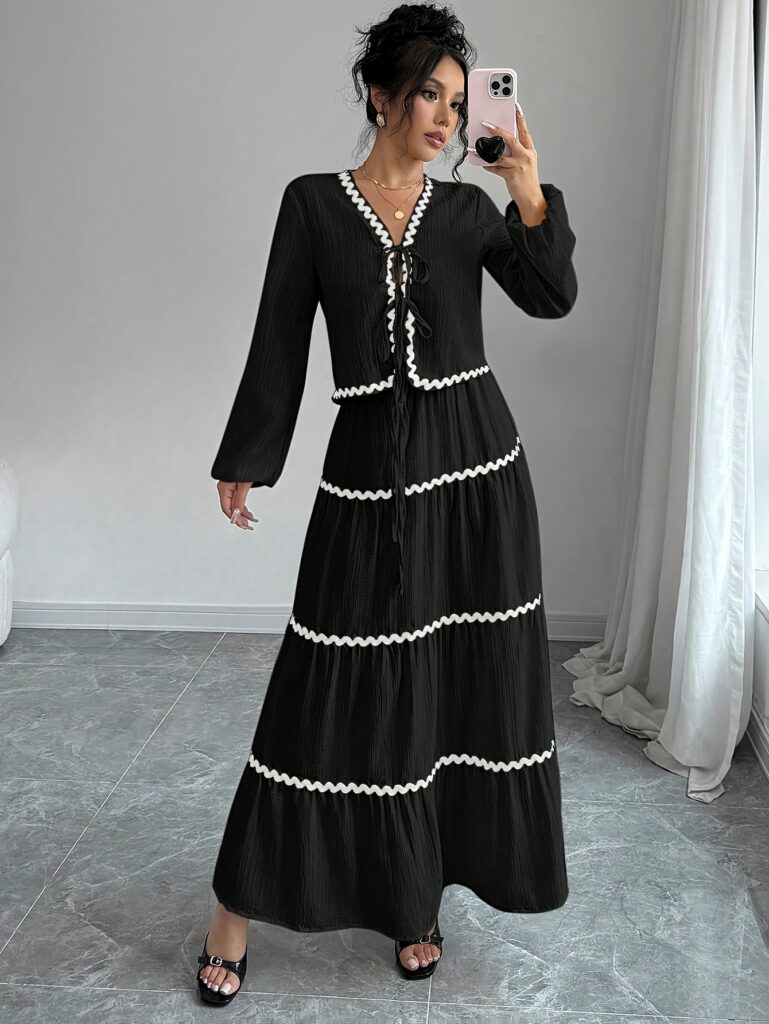 Effortlessly chic Casablanca Tiered Maxi Skirt Set from Newness. Model showcasing the complete set, featuring a flowing maxi skirt with tiers and a coordinating top.