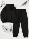 The Newness Minimalist Letter Print Two Piece Set in a cozy autumnal setting A stylish model wears the matching top and pants showcasing the comfortable fit and minimalist letter print Perfect for lounging or a casual day out