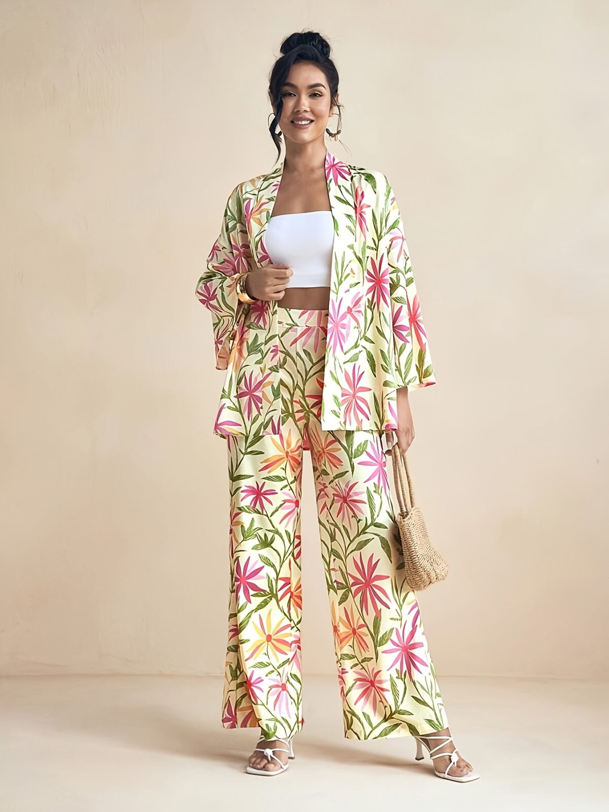 Model wearing the Newness Summer Escape Tropical Print Suit a vibrant and chic outfit perfect for beach vacations and beyond