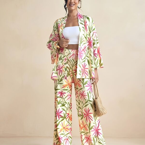 Model wearing the Newness Summer Escape Tropical Print Suit a vibrant and chic outfit perfect for beach vacations and beyond