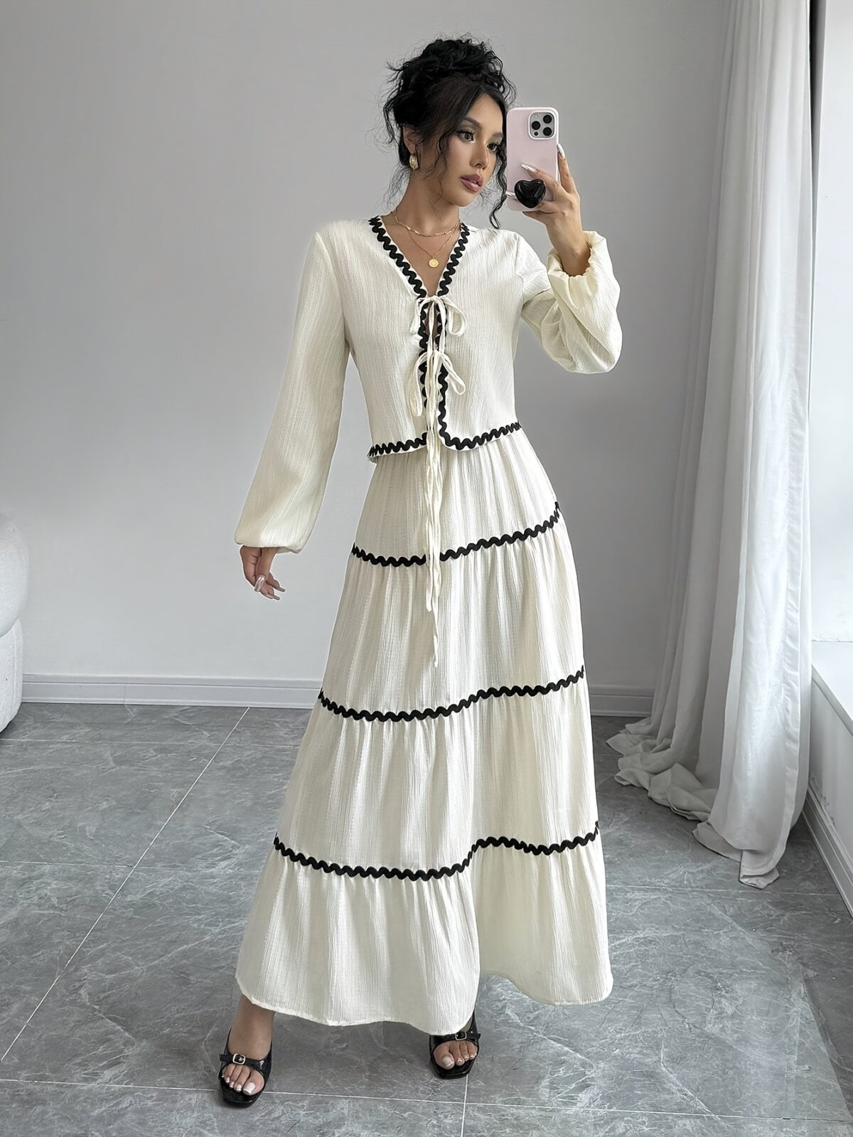Effortlessly chic Casablanca Tiered Maxi Skirt Set from Newness Model showcasing the complete set featuring a flowing maxi skirt with tiers and a coordinating top