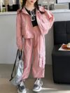 Girl wearing a stylish hooded suit perfect for spring Dubai inspired design