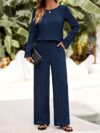 The Newness Milan Solid Color Pantsuit in a flattering pose This chic pantsuit crafted from smooth polyester is perfect for spring and fall The model showcases its versatile style and sophisticated fit