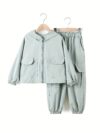 Girl wearing a stylish hooded suit perfect for spring Dubai inspired design