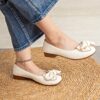Womens elegant low heel flats with a 3D bow detail round toe and soft synthetic cover Shown in Color Name