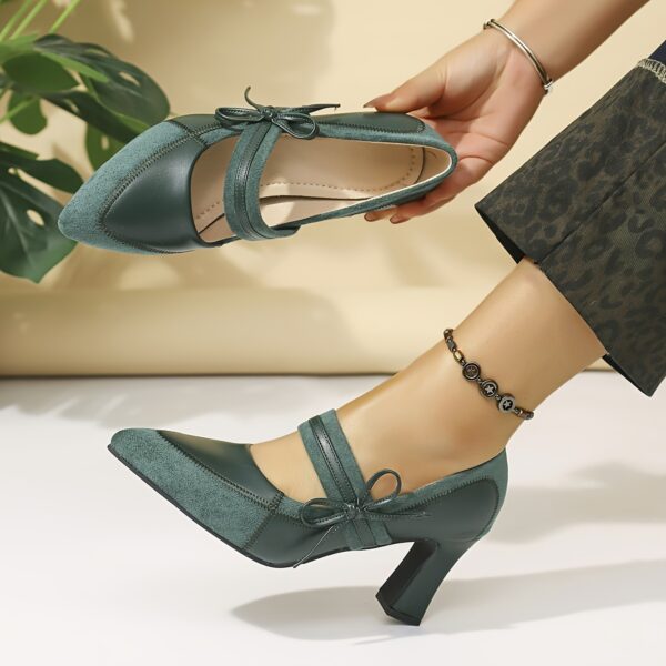 A pair of retro style embroidered womens high heel shoes in a pointed toe design