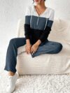 The Newness Riviera Color Block Hoodie Set in a flattering pose showcasing its vibrant color blocking and comfortable fit Perfect for spring or fall