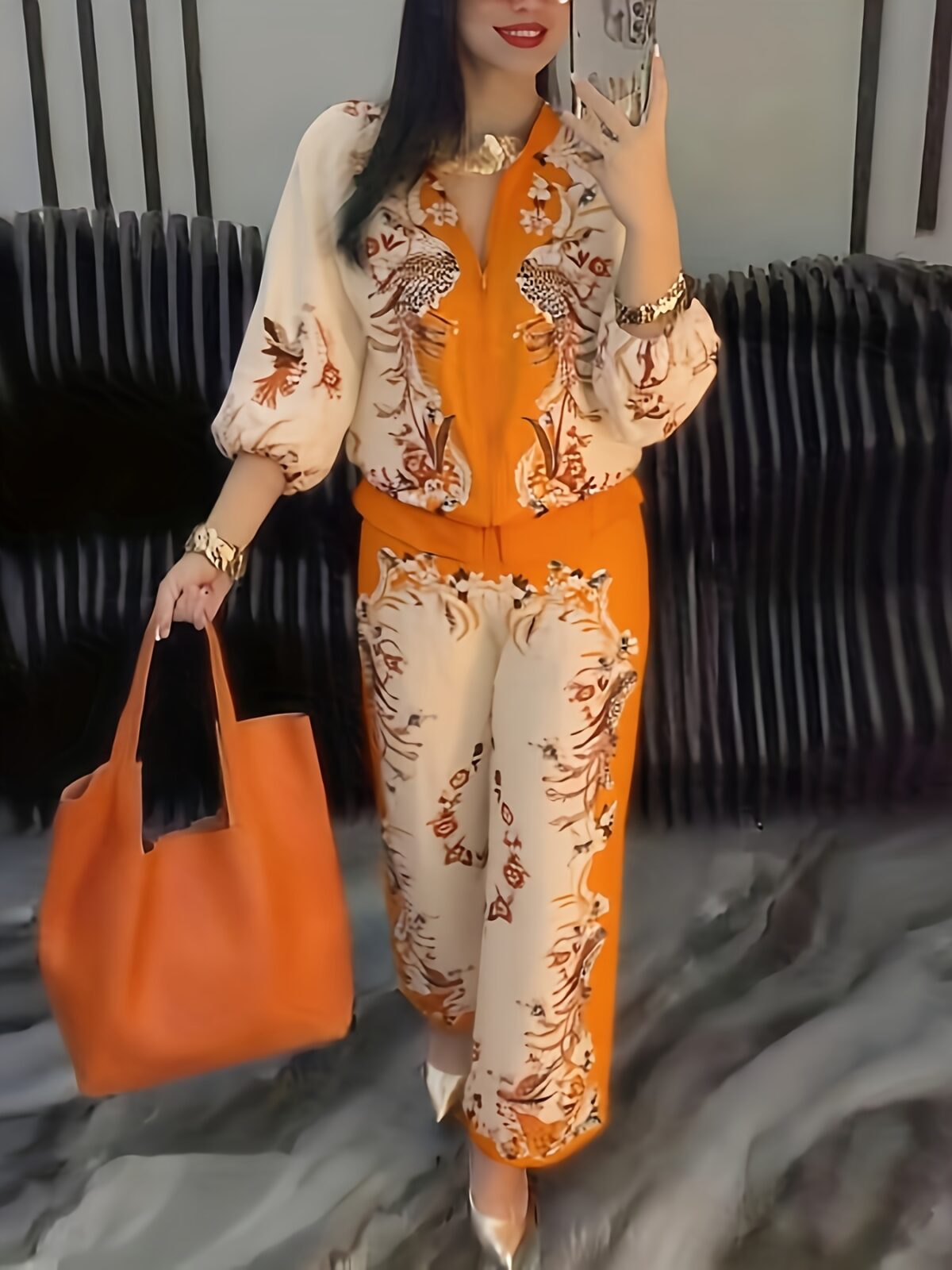 Model wearing the Newness Sunset Hues Ombre Print Two Piece Set showcasing the gradient colors and comfortable fit