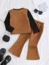 Adorable girl twirling in the Newness Starlight Dreams Girls Western Set showcasing its sparkly details and stylish western design Perfect for parties or playtime