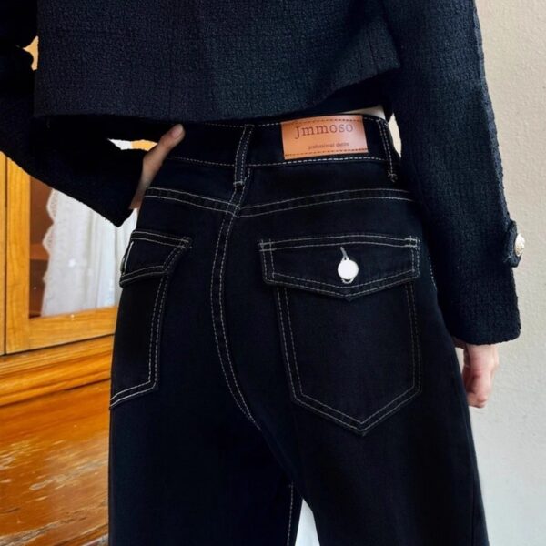 Newness Midnight Hour Black High Waisted Jeans A model showcasing the flattering fit and chic style of the jeans
