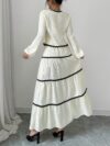 Effortlessly chic Casablanca Tiered Maxi Skirt Set from Newness Model showcasing the complete set featuring a flowing maxi skirt with tiers and a coordinating top