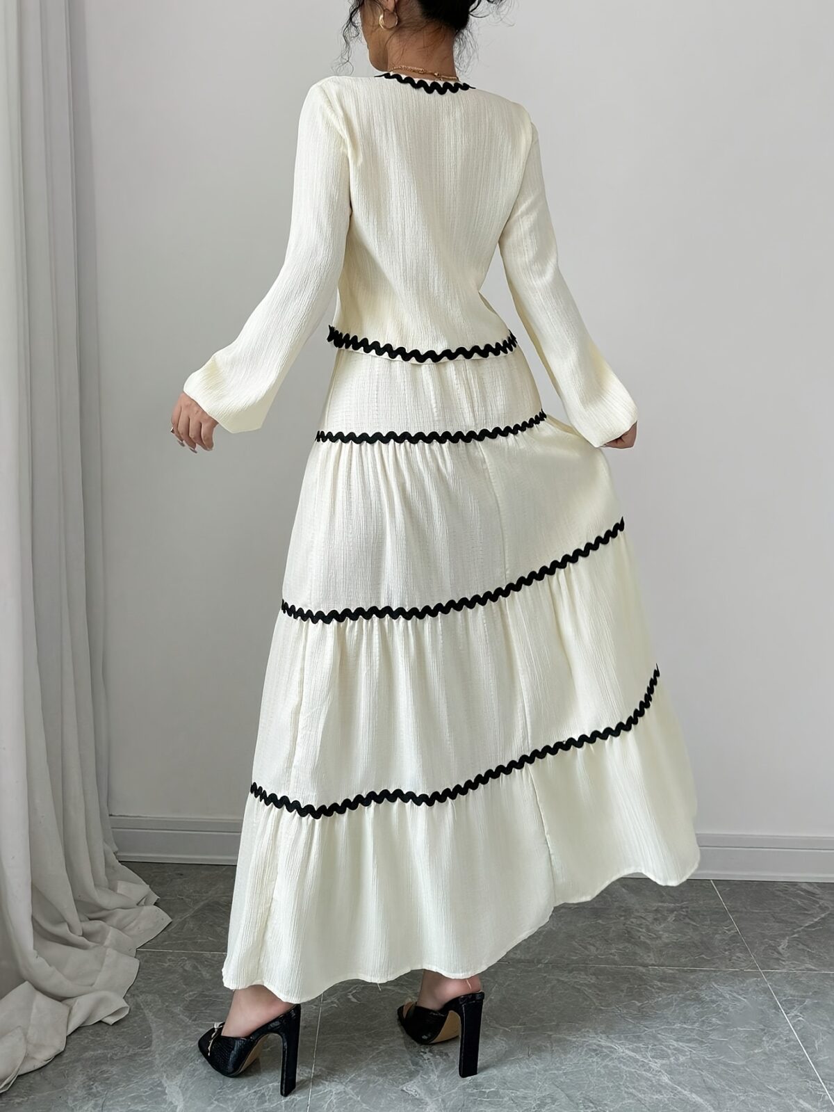 Effortlessly chic Casablanca Tiered Maxi Skirt Set from Newness Model showcasing the complete set featuring a flowing maxi skirt with tiers and a coordinating top