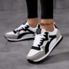 Newness City Stroll Striped Casual Sneakers Effortlessly stylish striped sneakers perfect for all day wear Image shows the sneakers from a side angle highlighting their comfortable design and vibrant stripes
