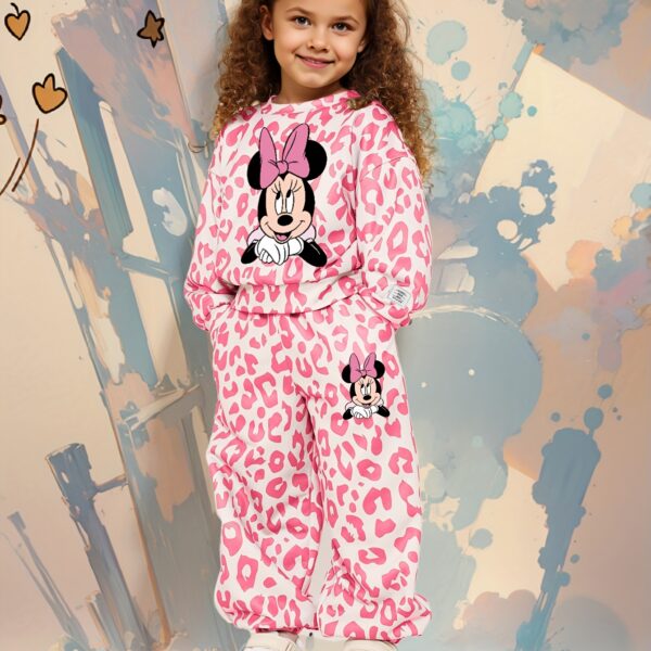 Adorable girl wearing a stylish leopard print set, perfect for play or everyday wear.