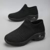 Womens black slip on sneakers with breathable knit upper comfortable wedge heel and cushioned sole
