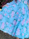 Embrace Parisian chic in the Newness Azure Bloom Floral Print Dress This stunning summer dress features a vibrant floral print