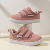 Kids pastel pink white black blue and grey low top sneakers with arch support Durable rubber soles and cushioned insoles provide all day comfort