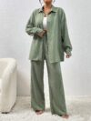 Model wearing the Newness Dubai Nights Off Shoulder Pants Set a luxurious polyester two piece outfit featuring an off shoulder top and wide leg pants perfect for evening events
