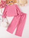 Adorable girls two piece outfit in breathable fabric featuring a charming bow detail and stylish wide leg pants perfect for autumn outings