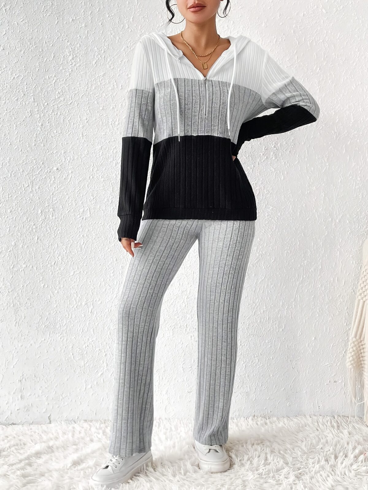 The Newness Riviera Color Block Hoodie Set in a flattering pose showcasing its vibrant color blocking and comfortable fit Perfect for spring or fall