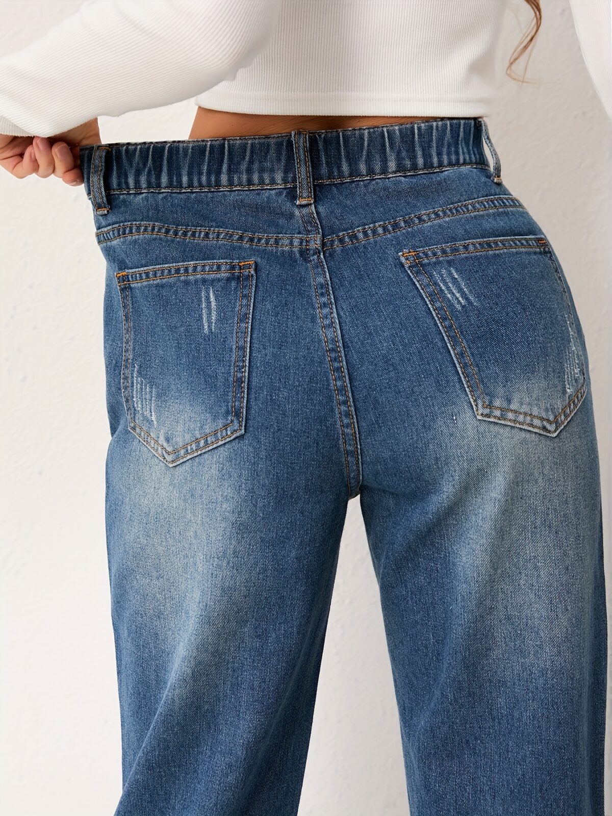 Newness Effortless Chic Straight Leg Jeans Flattering straight leg jeans in a versatile wash designed for both comfort and style Model showcases the perfect fit and drape