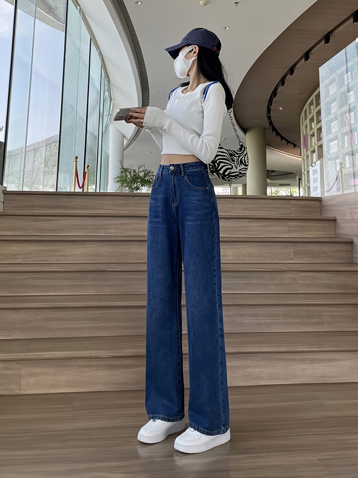 Flatlay of Newness Parisian High Waisted Wide Leg Jeans in a stylish setting The durable denim and flattering wide leg silhouette are highlighted