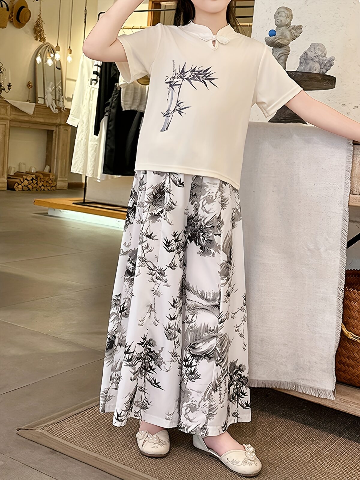 Newness Botanical Bliss Girls Summer Outfit A charming two piece set ideal for summer Features a stylish top and comfortable bottoms in a botanical print