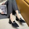 Newness The Chelsea Modern Block Heel Pumps in black showcasing the elegant silhouette and comfortable block heel Perfect for any occasion