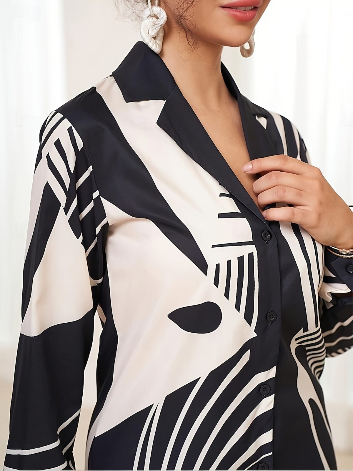 Stylish monochrome two piece set with a geometric print Perfect for spring and summer