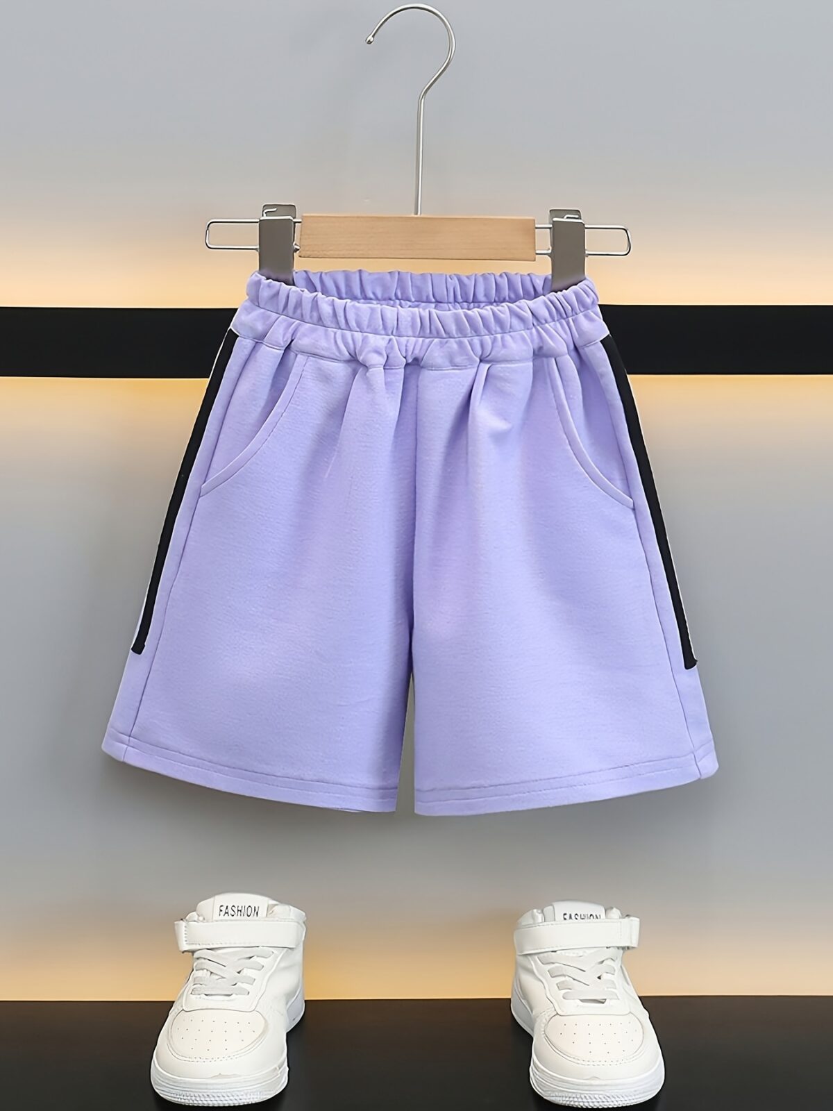 Stylish purple sports set for boys aged 12 and under Breathable polyester fabric ensures comfort and freedom of movement Perfect for summer activities