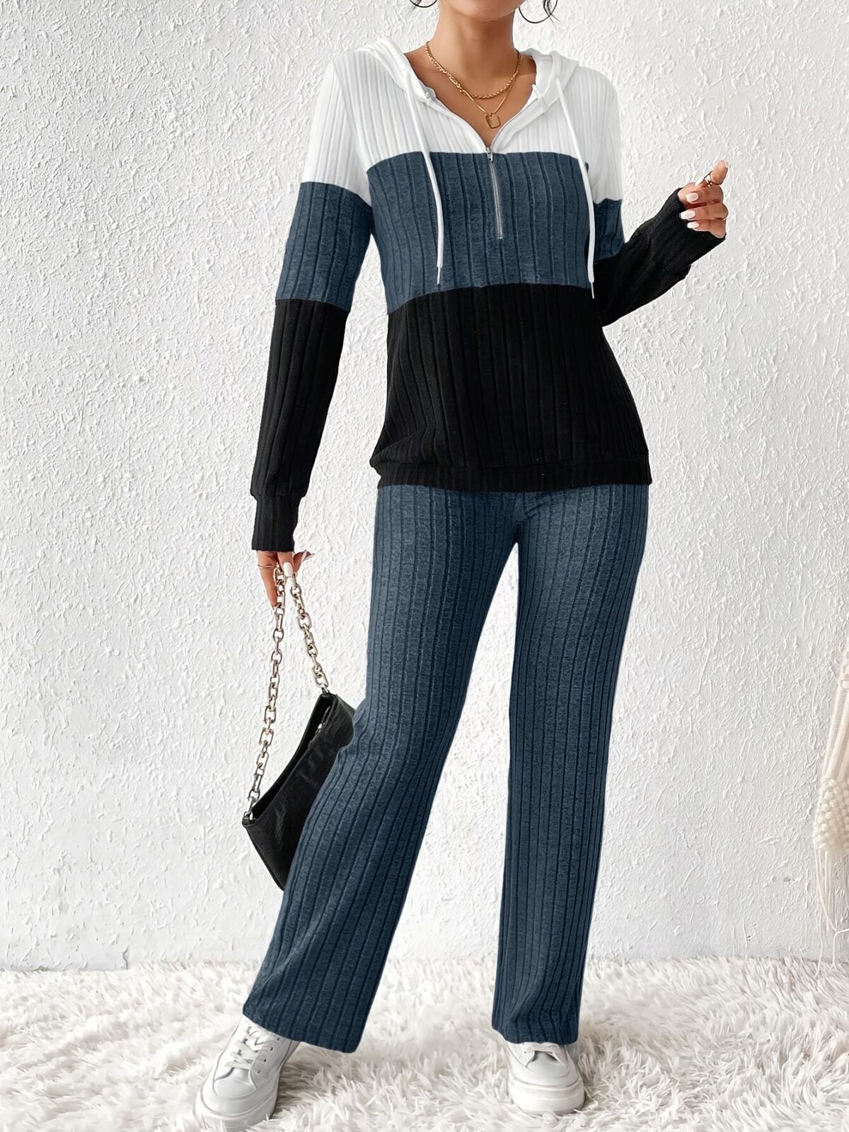 The Newness Riviera Color Block Hoodie Set in a flattering pose showcasing its vibrant color blocking and comfortable fit Perfect for spring or fall