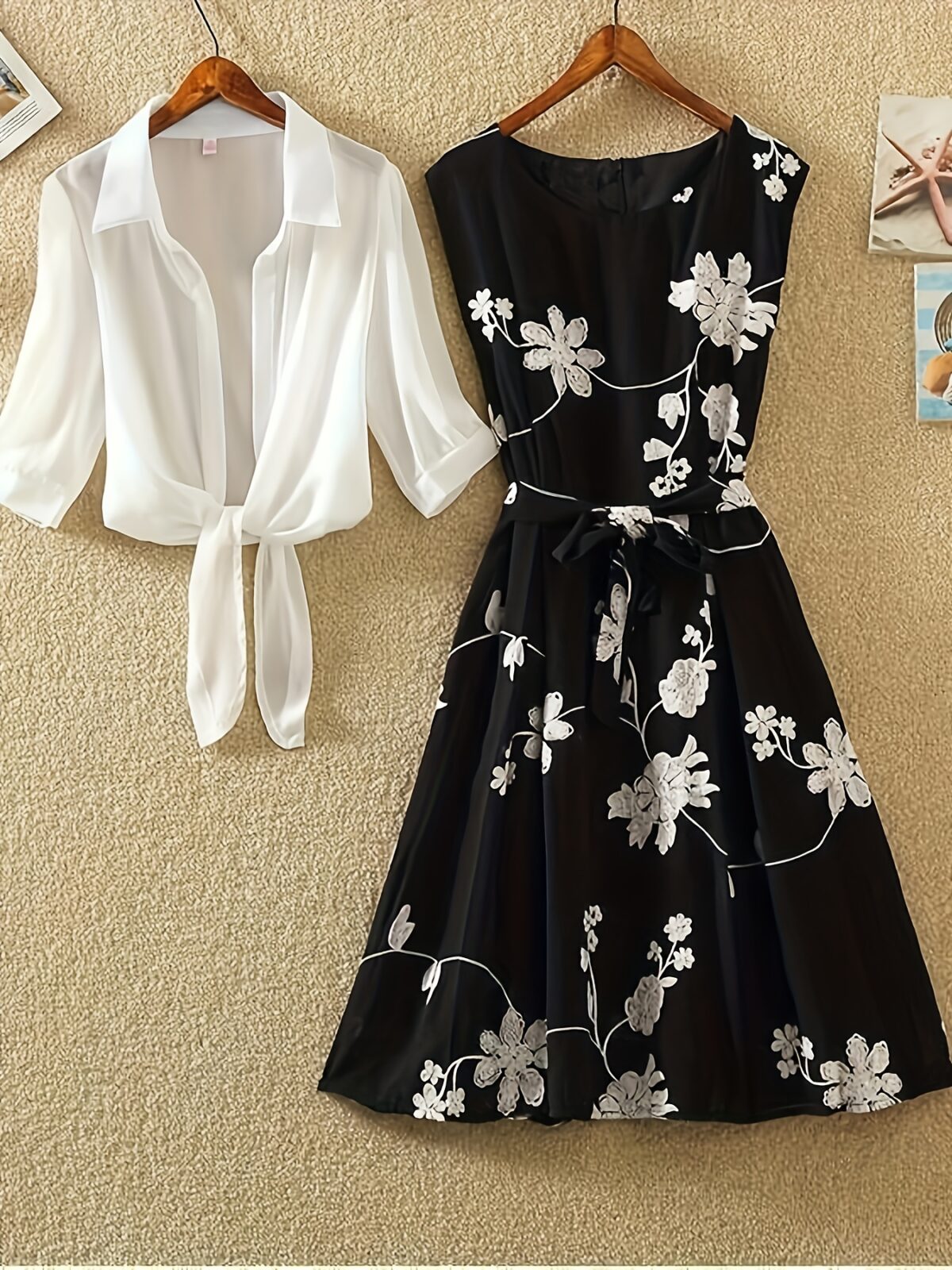 Model wearing the Newness Summer Solstice Floral Print Dress a chic and flattering midi dress with a retro inspired floral print perfect for summer