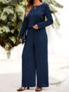 The Newness Milan Solid Color Pantsuit in a flattering pose This chic pantsuit crafted from smooth polyester is perfect for spring and fall The model showcases its versatile style and sophisticated fit